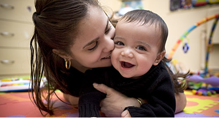 Healthy Start - Interconception 1 woman laying on floor with smiling infant